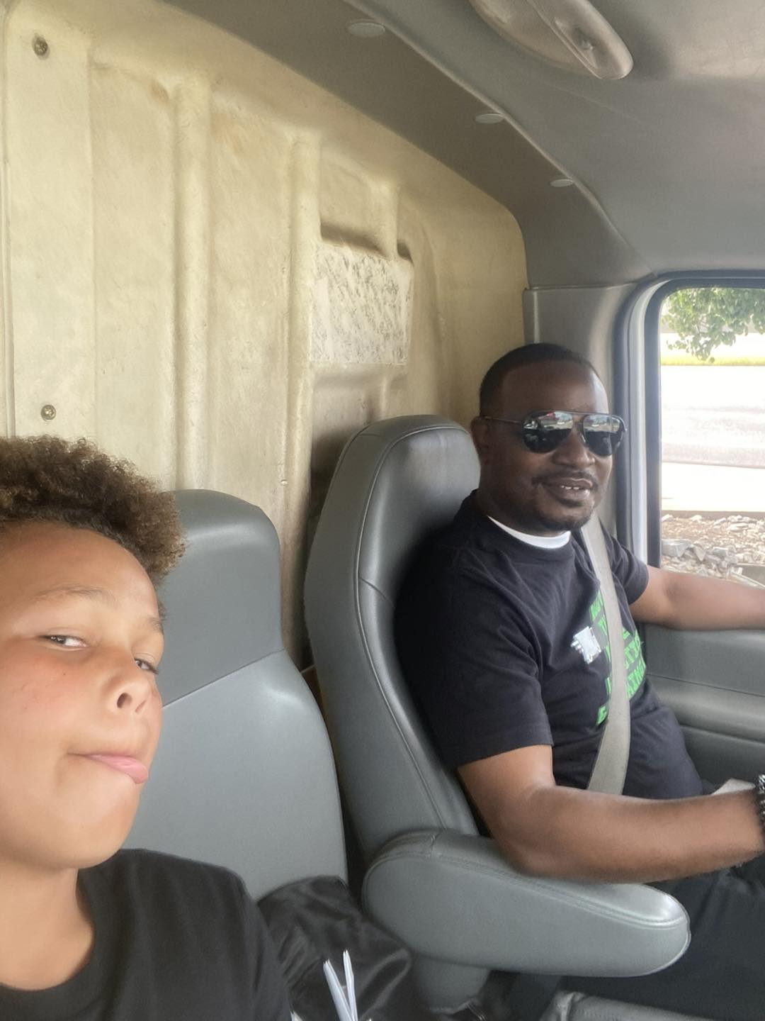 father and son in moving van father and son in moving van